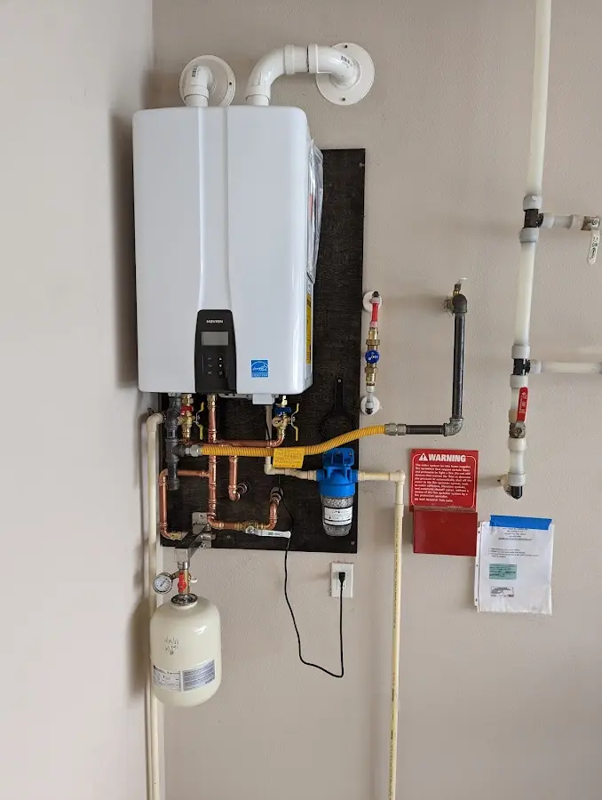 Professional plumber installing copper piping in a Fruitvale home